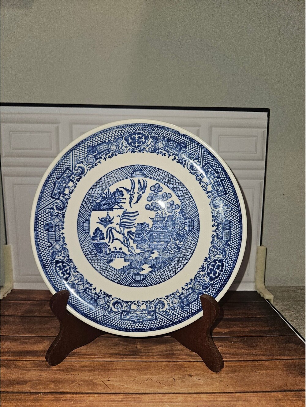 Vintage Blue and White Collector Plate with Asian-Inspired Design